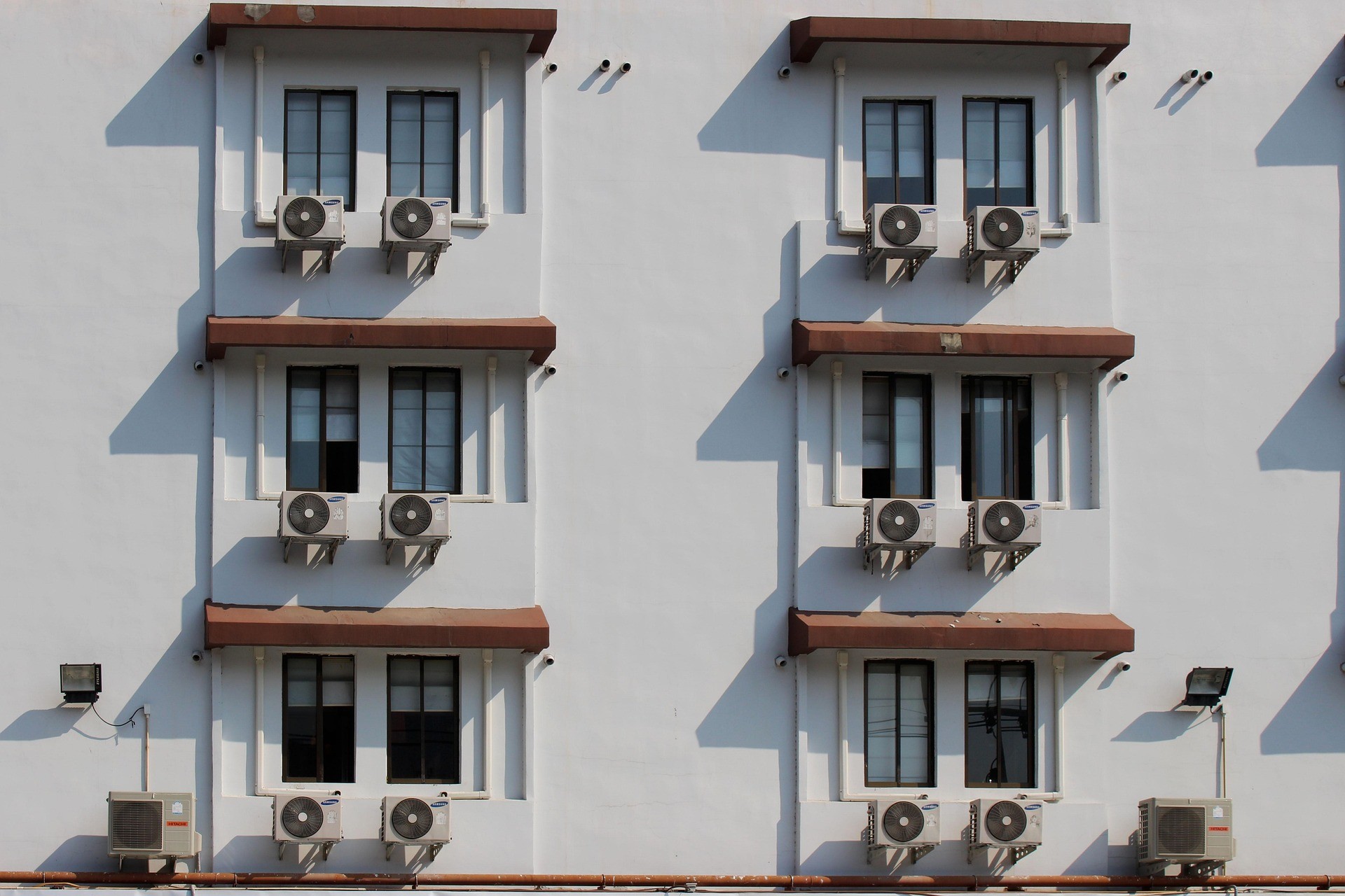 Building facade with multiple outdoor air-conditioning units