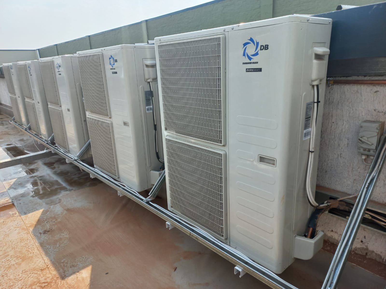 Row of rooftop air-conditioning condenser units